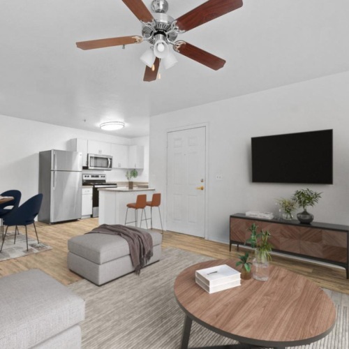 a living room with a tv and couches