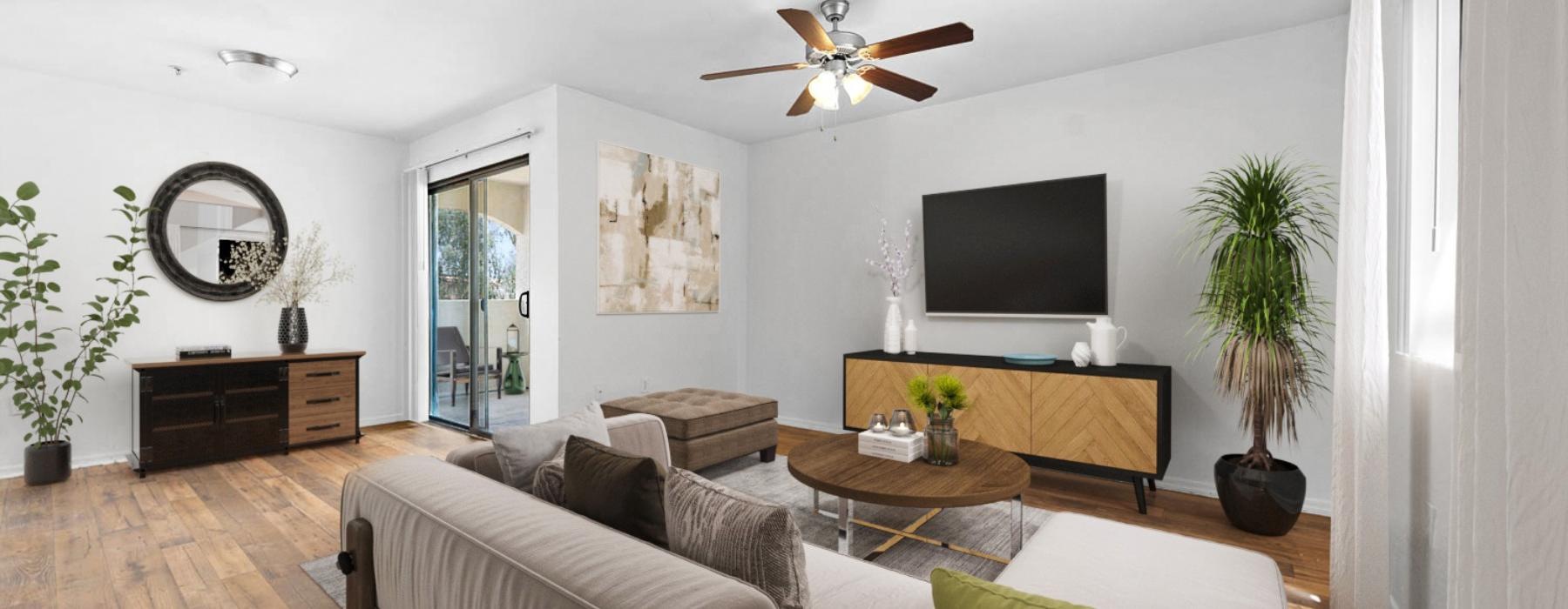 a living room with a tv and couches