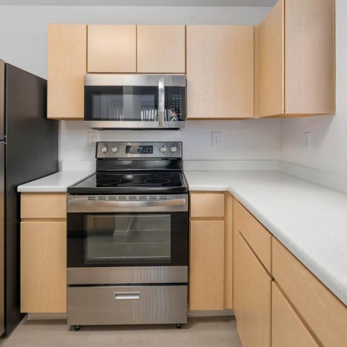 a kitchen with wooden cabinets
